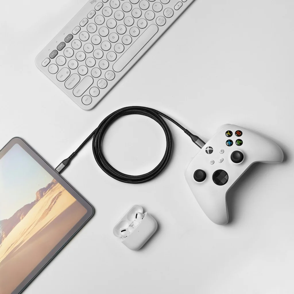 a white controller and a tablet on a table - OBS streaming software